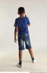 TIMBO STANDING POSE WITH GUN